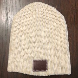 Love Your Melon cream hat with brown leather tag